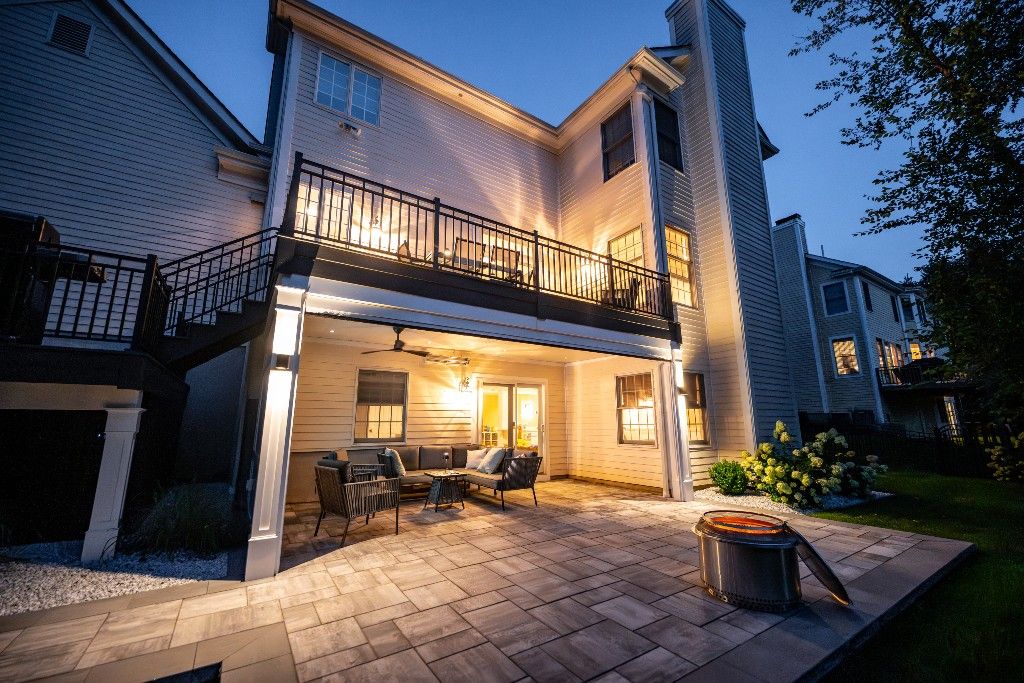 Raised deck and covered patio at dusk