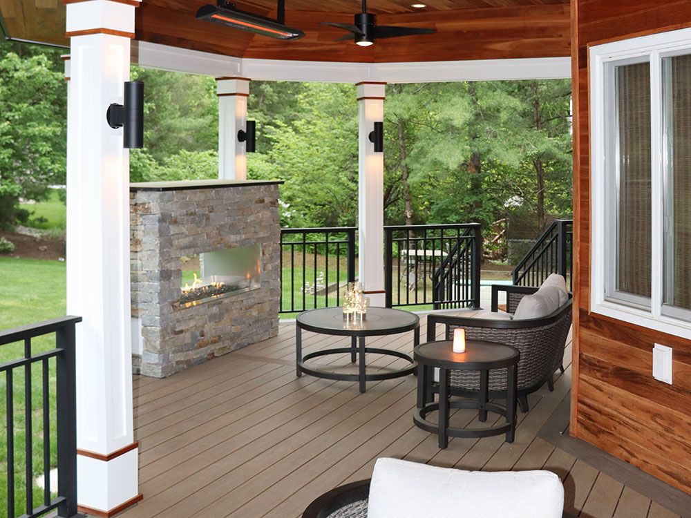 Covered Patio with Stone Fireplace by SCPC Construction